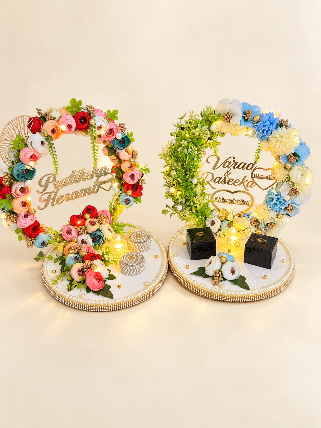 Two personalised floral ring platters with lights and ring boxes