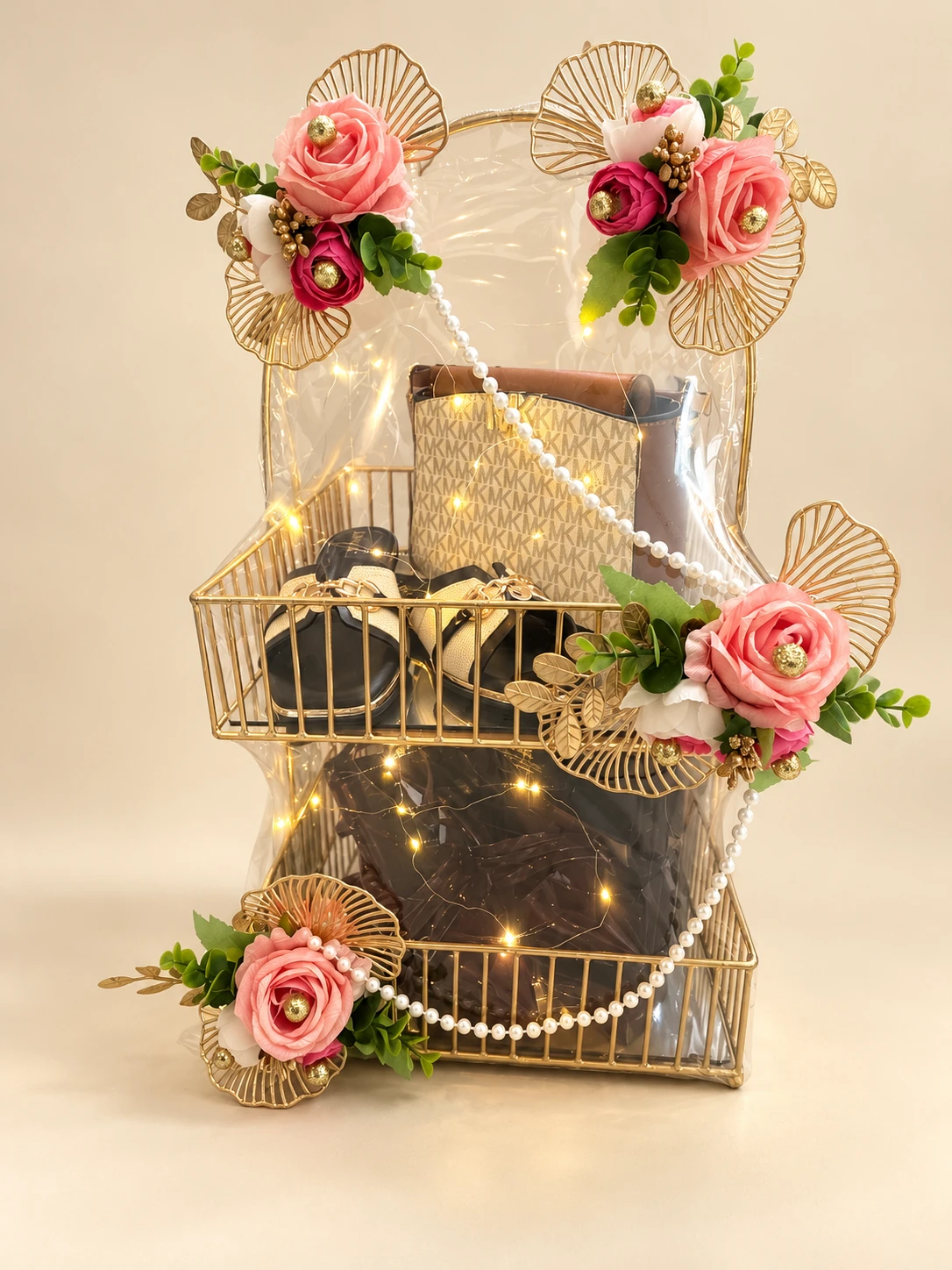 Two-tier gold wire display with accessories, roses and fairy lights